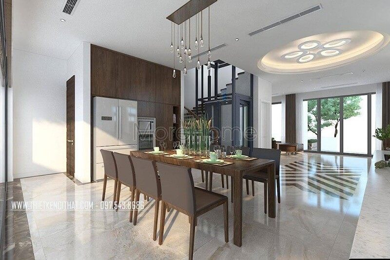 Không gian phòng ăn biệt thự hiện đại được làm nổi bật bởi bộ bàn ăn gỗ tự nhiên.